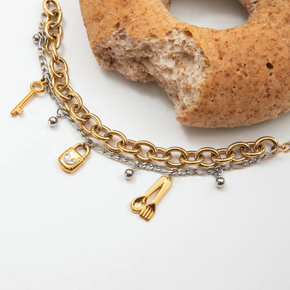 Mixed-Metal Charm Statement Bracelet
